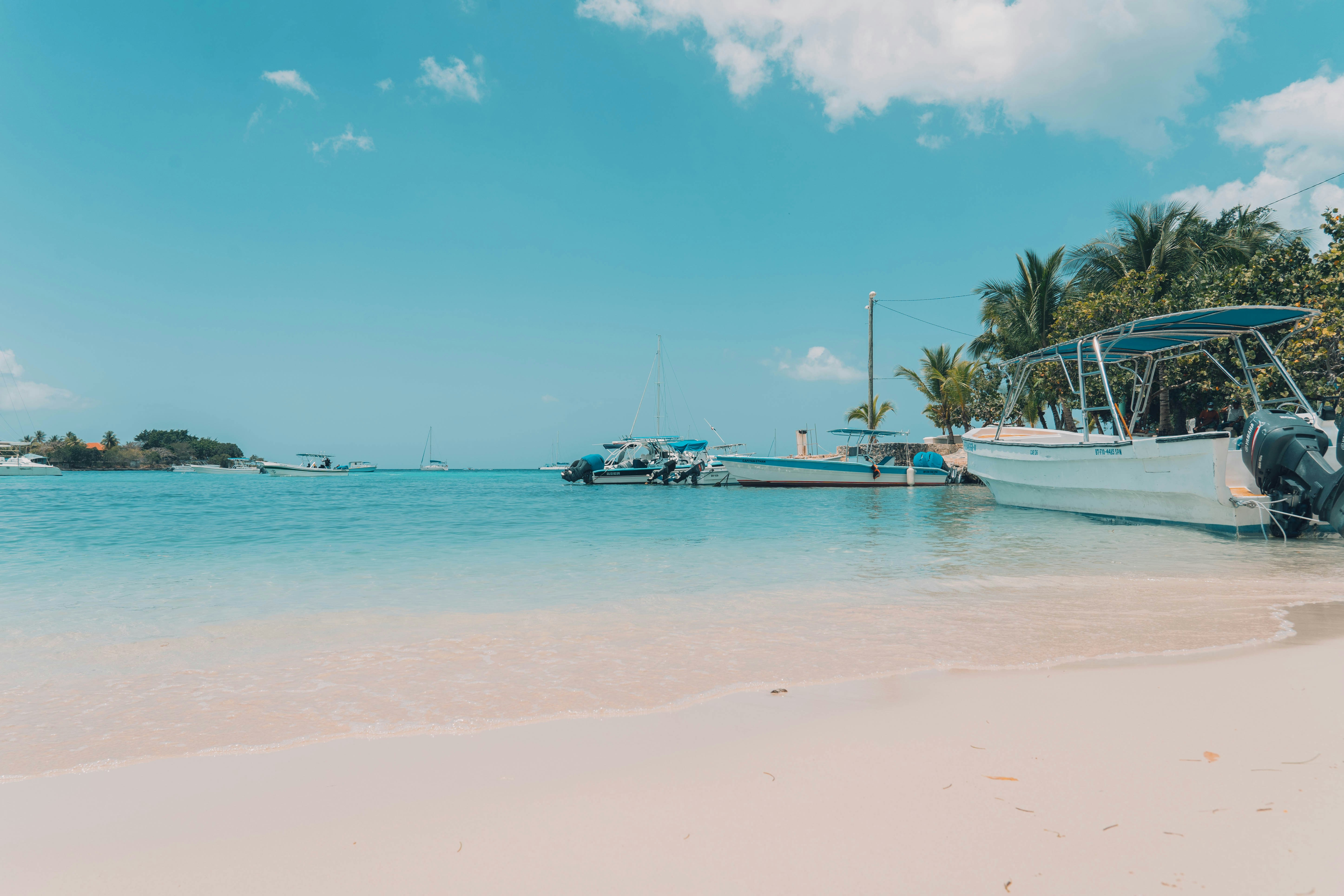 Tropical turquoise beach boat anchored Bayahibe Dominican Republic