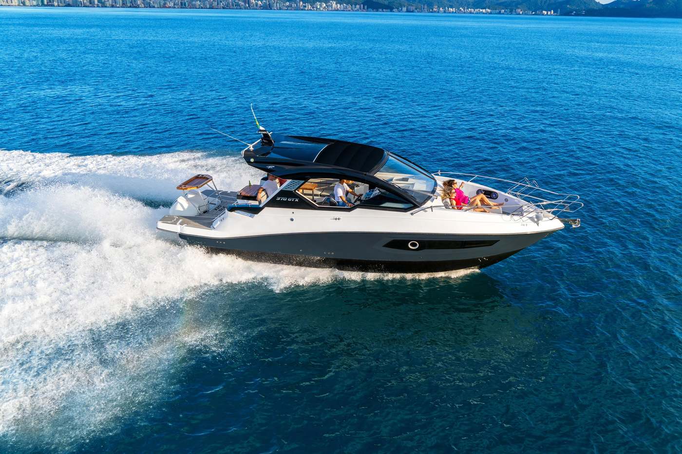 Private lancha speedboat on turquoise Caribbean water near Cartagena Colombia with Rosario Islands in background